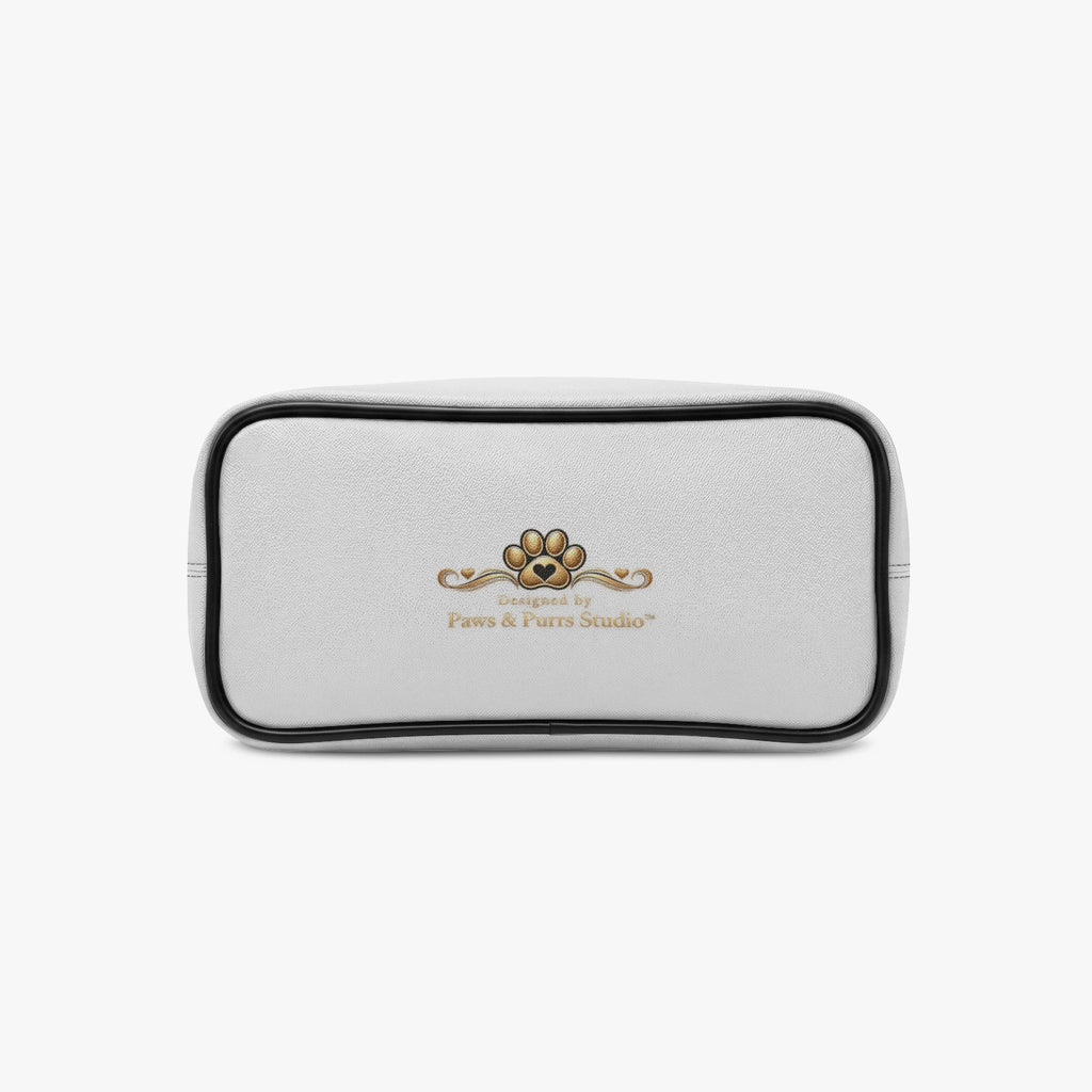 Bottom of the Adventure Together pet carrier tote with black edging and a small Paws & Purrs Studio logo.